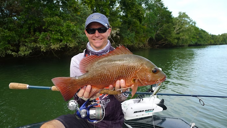 Tackle World expert Derek Maynard holding a mangrove jack, sharing expert insights and techniques for catching this prized fish species