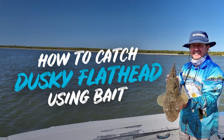 How to catch dusky flathead using bait, with a happy angler holding a big fish.