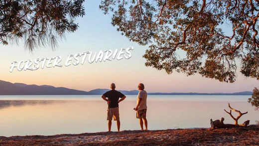 Two fishermen overlooking the scenic Forster estuary in NSW, preparing for a holiday fishing adventure in Australia