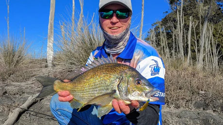 Tackle World expert displaying a prize bream caught in Southern NSW, highlighting effective bait and lure techniques for bream fishing